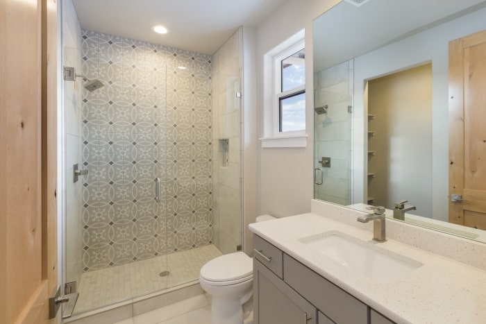 Shower with glass door enclosure