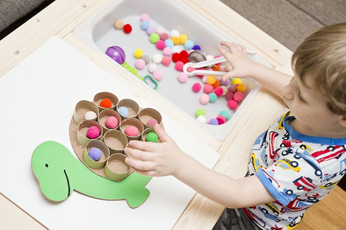 Happy turtle. Sorting game for toddlers. Fill cells with pompoms. Early education, learning colors and counting. Montessori thematic implement for preschool and special needs school