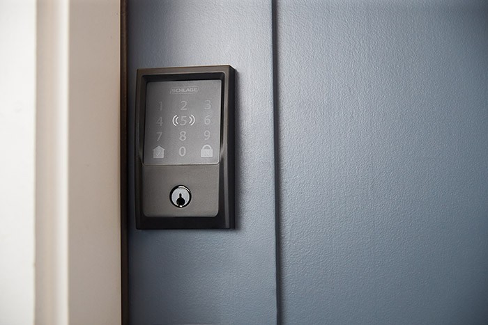 Schlage Encode Plus smart lock on a blue door.