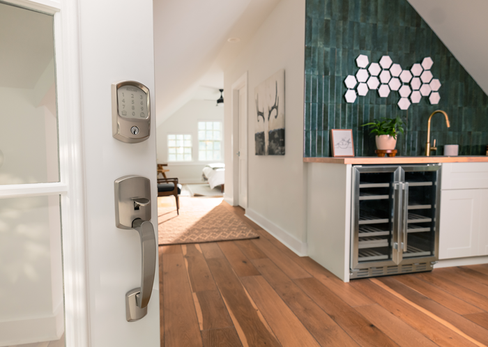 Open front door revealing home with beautiful hardwood flooring.