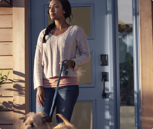 Woman leaving her home with the Encode smart lock in the background.