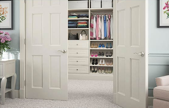 Walk in closet with French doors.