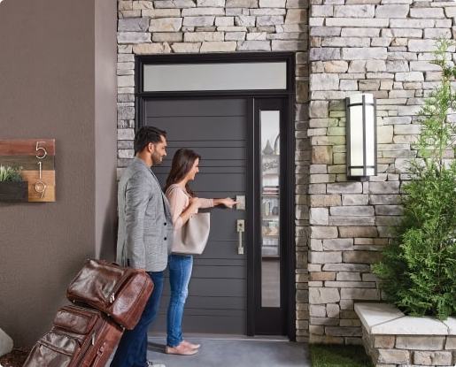 Airbnb guest using a code to unlock the door of their rental property