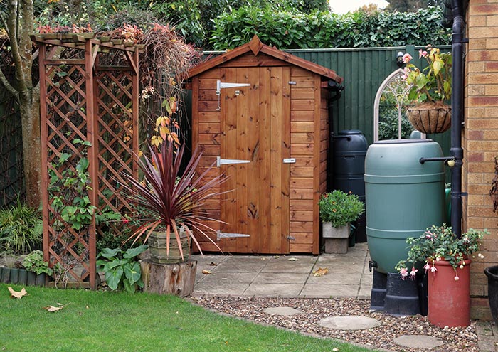 Garden shed with water barrels