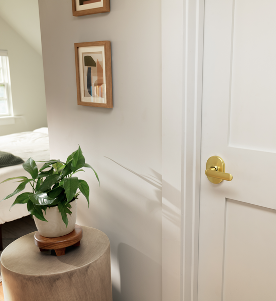 Bright brass lever on bedroom door