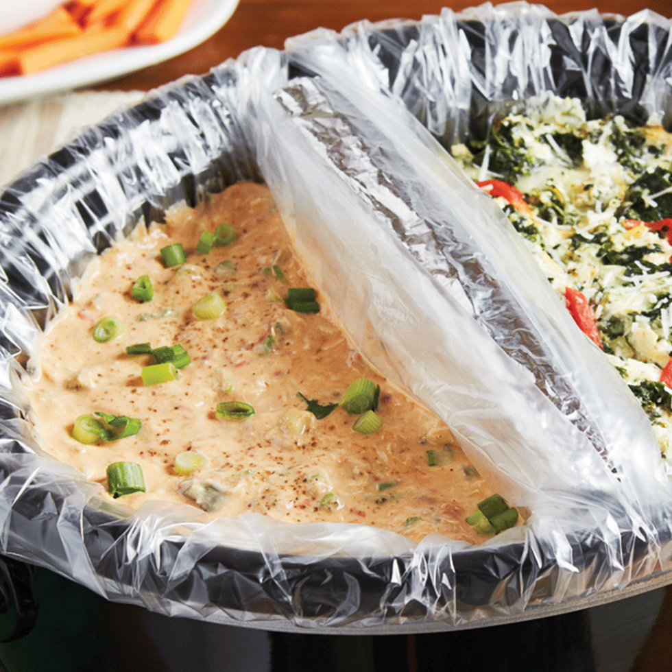 Crockpot with two liners holding two separate dips.