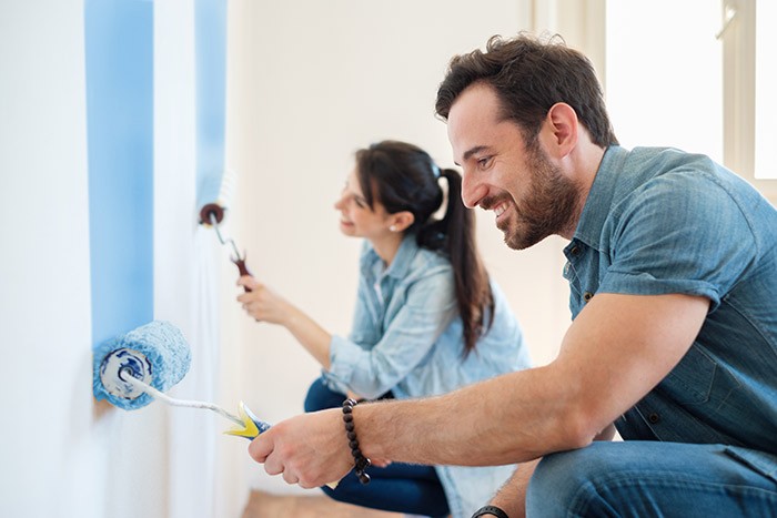 Renovation diy paint couple in new home painting wall together