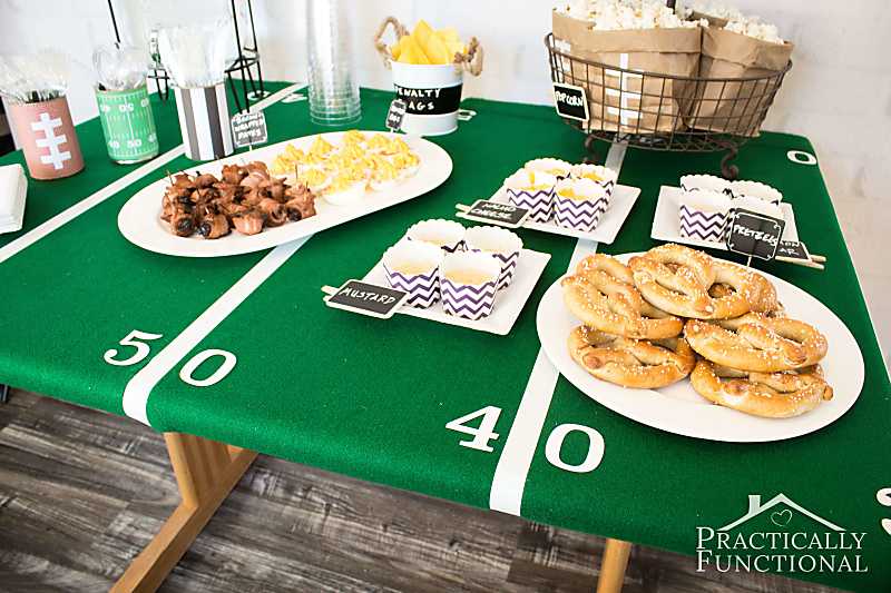 Green tablecloth decorated to look like a football field.