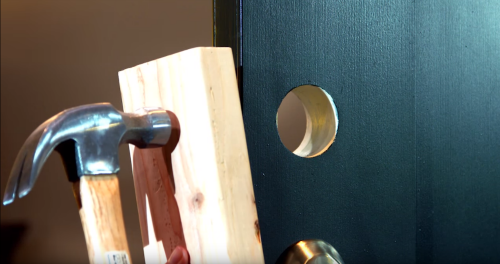 For the drive-in faceplate, slide it into place with the word “top” facing up and gently tap it using a block of wood and hammer until it is flush with the door’s edge.