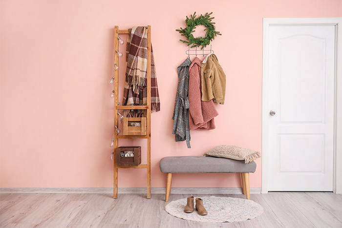 https://www.schlage.com/content/dam/sch-us/blog/post-images/2019/11-november/winter-mudroom-entrance-with-pink-walls-and-winter-clothing.jpg